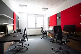 Office with chairs and monitors 