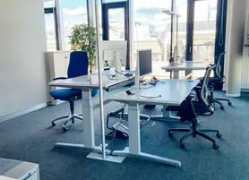 Two desks in an open-plan office